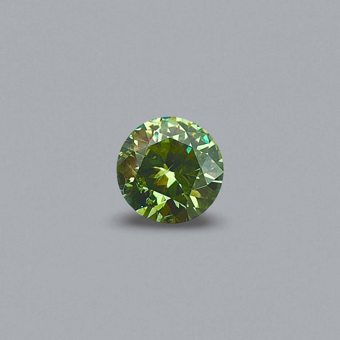 [BELLEROPHON] 0.91 CTS Intense Green Demantoid Garnet
