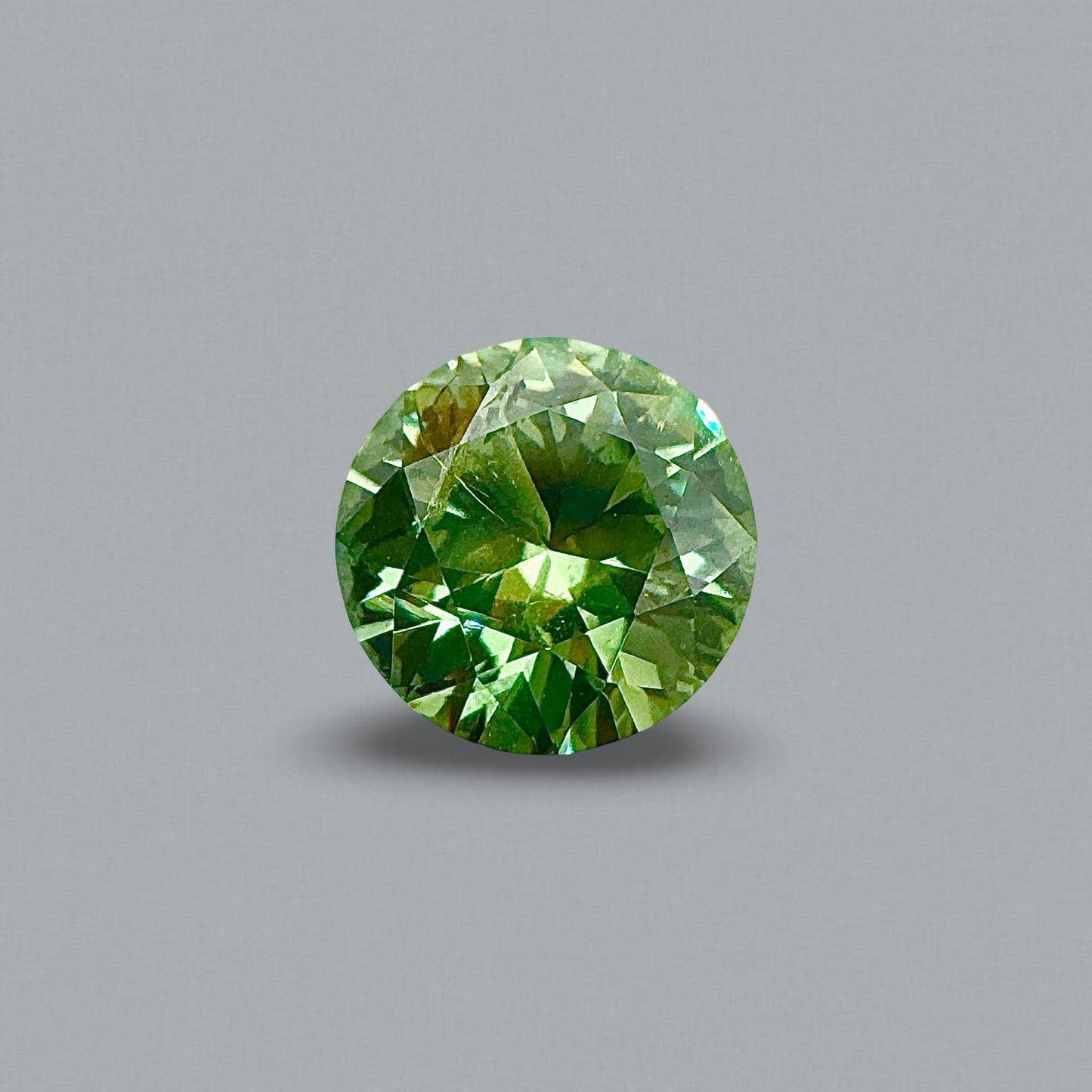 [BELLEROPHON] 1.19 CTS Intense Green Demantoid Garnet